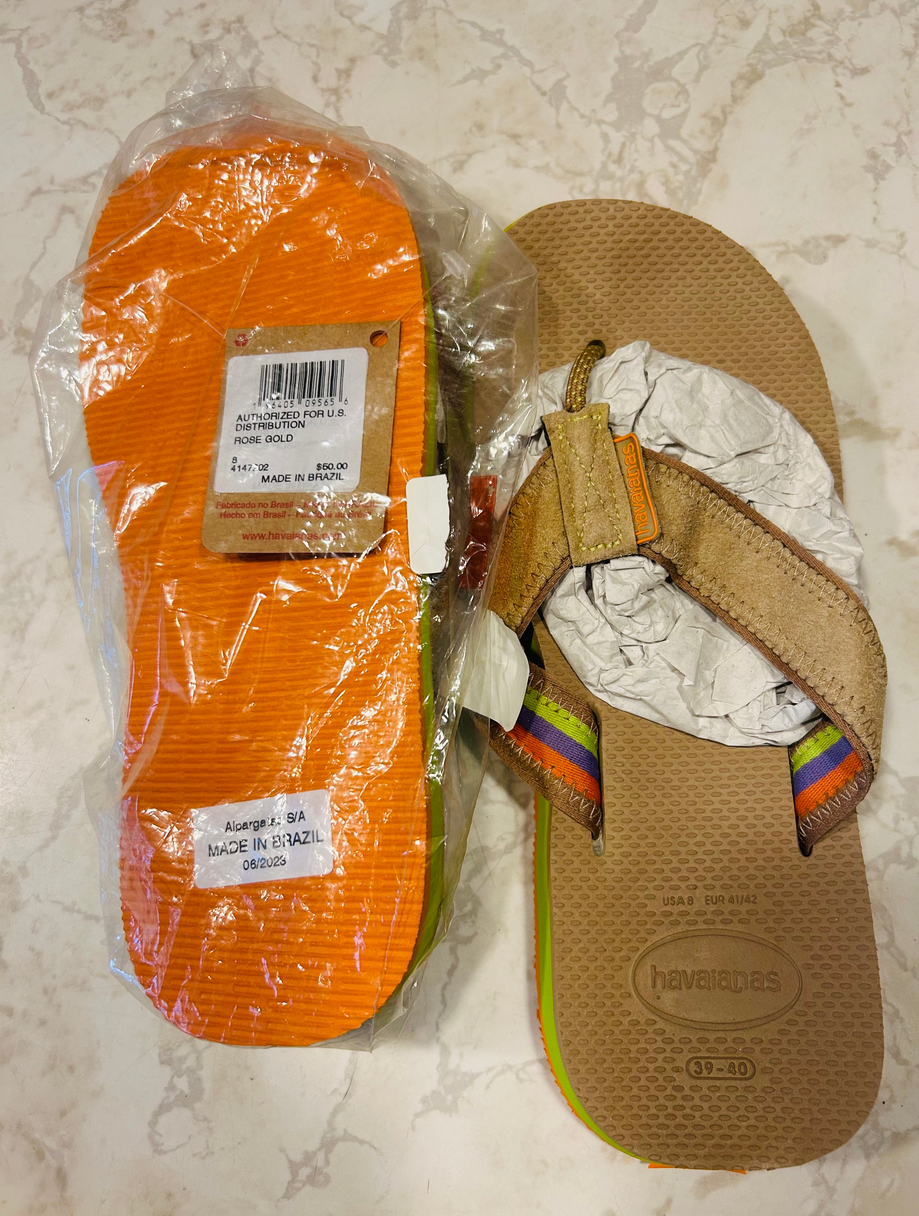 size 8 Havaianas Top flip flops in orange, made in Brazil.