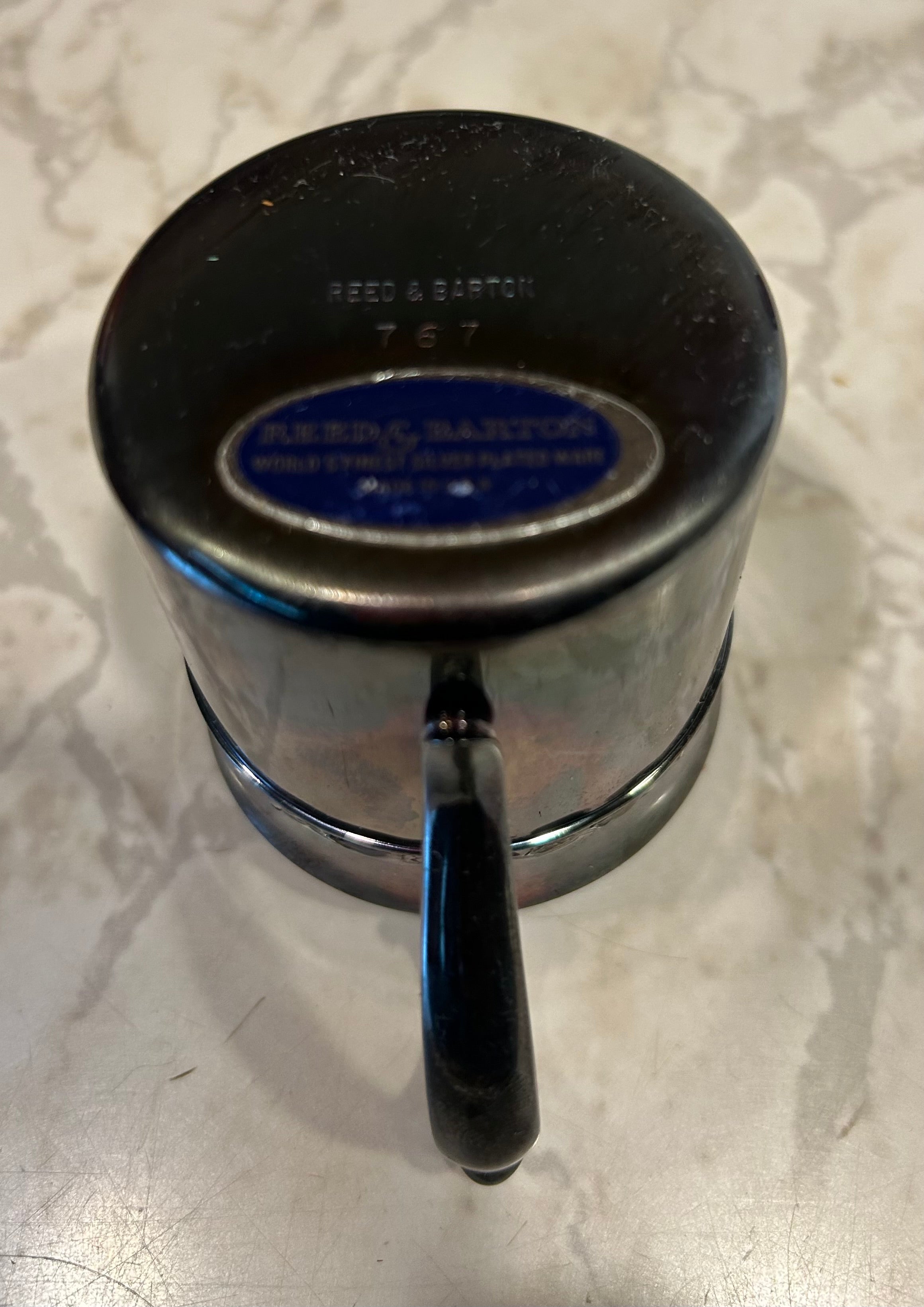 This is a vintage Reed & Barton silver-plated child's cup, model 767.