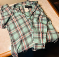 This is a new medium Fantaslook plaid flannel shirt for women featuring a relaxed, long-sleeve button-down design in aqua and pink tones
