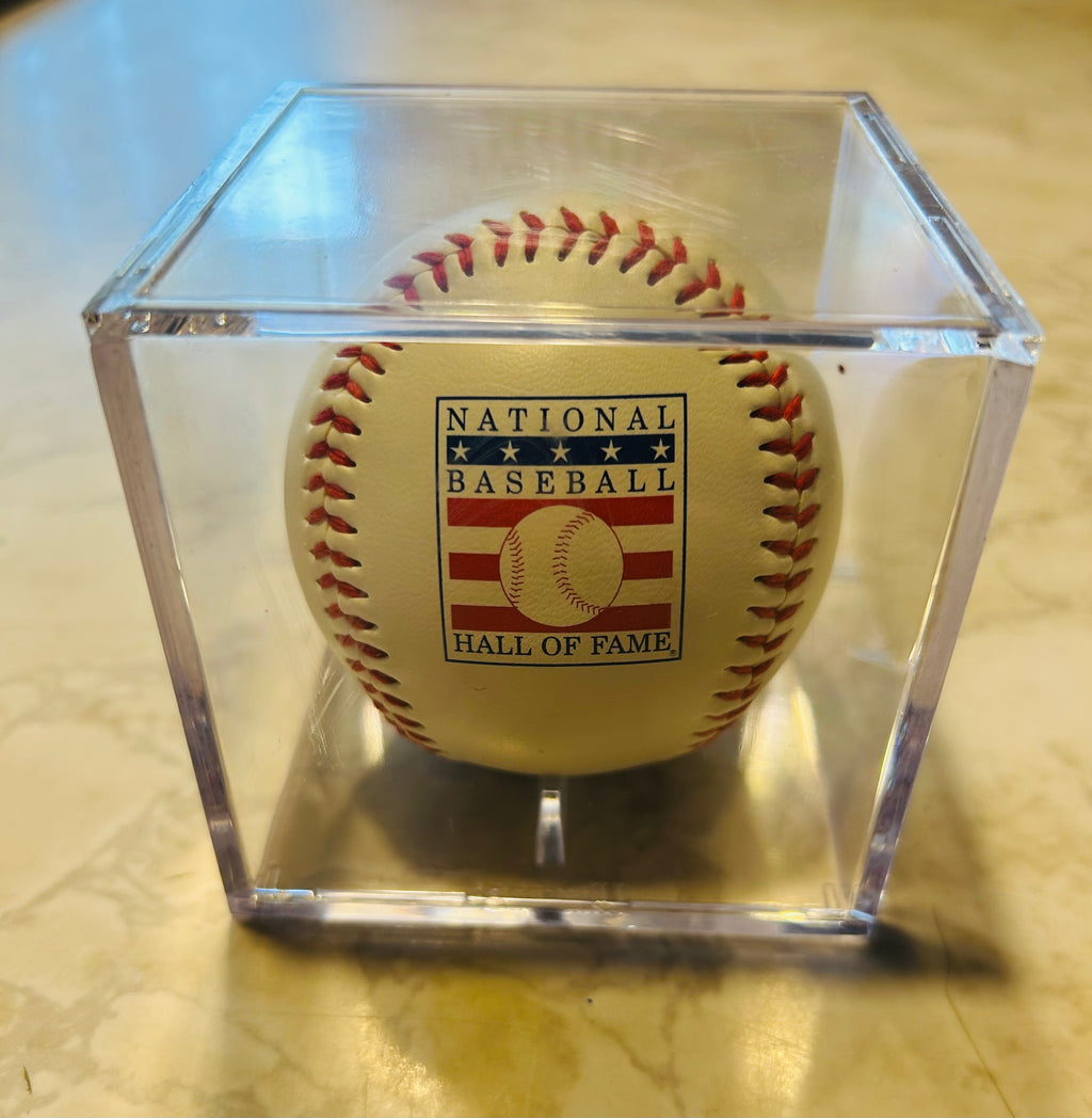 This item is a Rawlings National Baseball Hall of Fame souvenir baseball, often sold in clear plastic display cases.