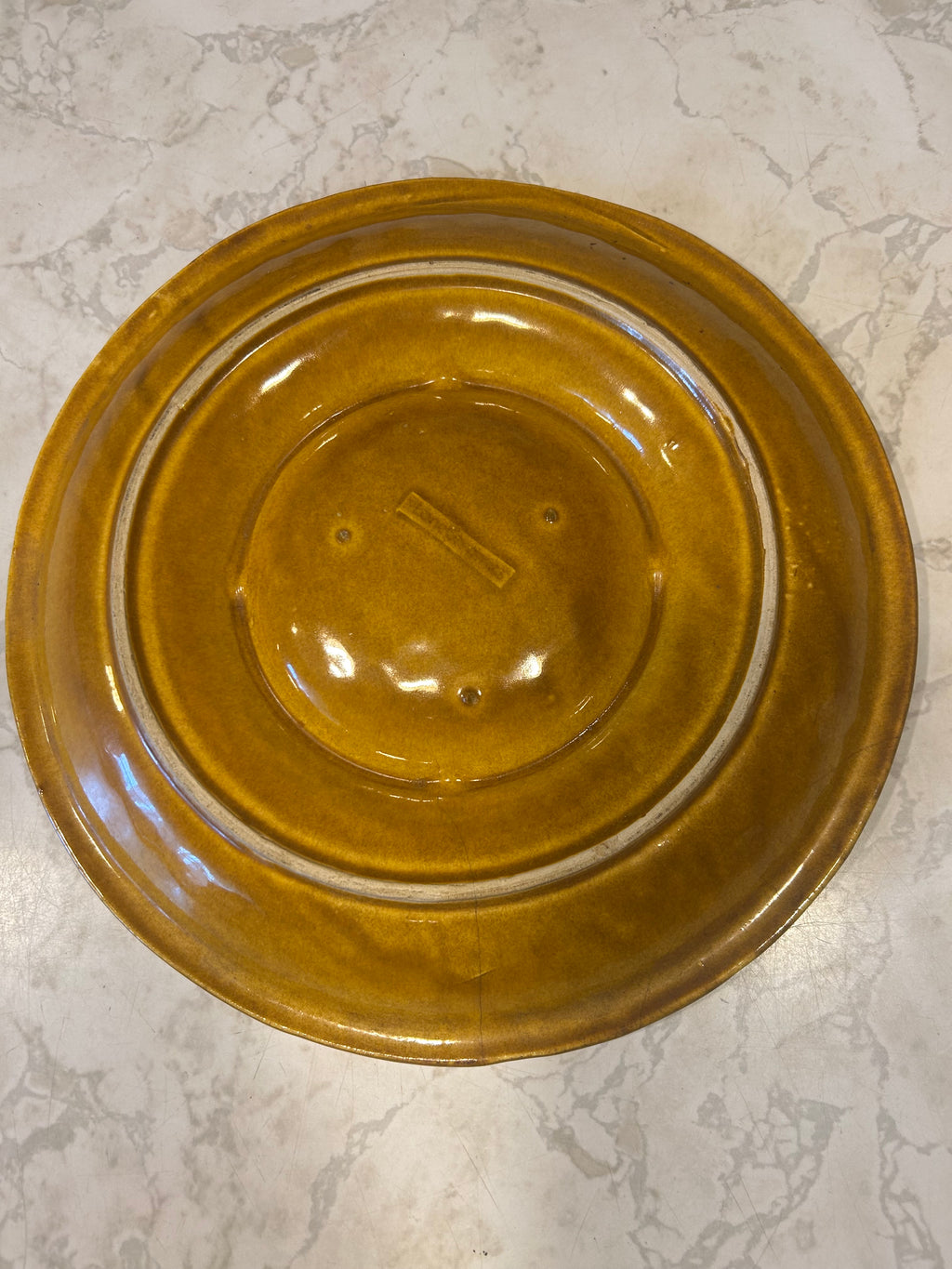This is a vintage Marcia of California ceramic pottery platter featuring a harvest gold and orange drip glaze.