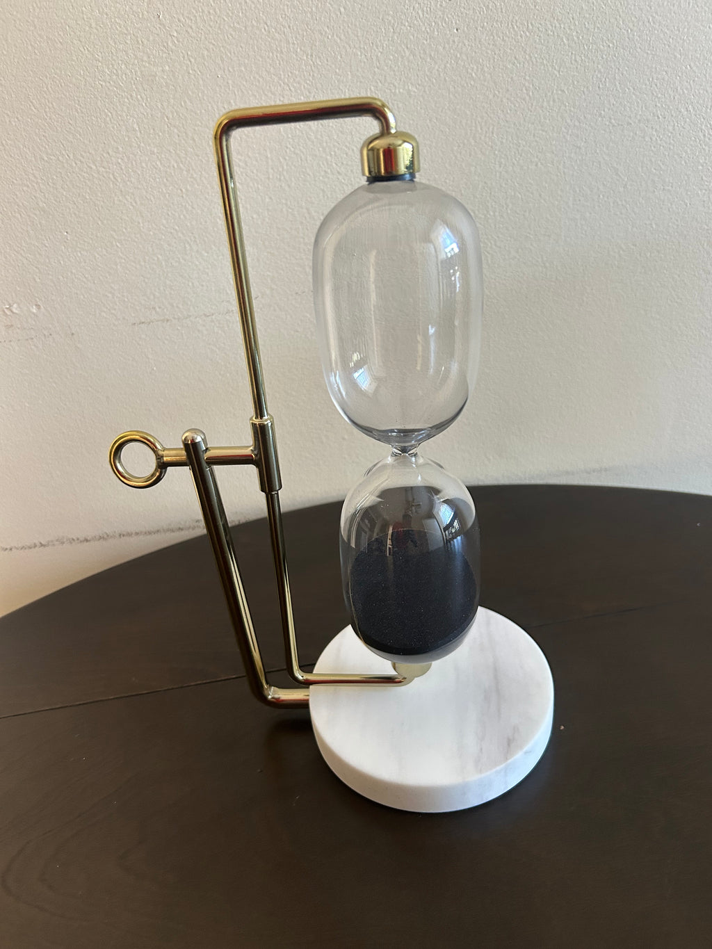 This is a Threshold brand decorative hourglass designed for tabletop display.