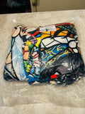 This is a packaged plush throw blanket featuring a colorful, stained-glass inspired graphic artwork.