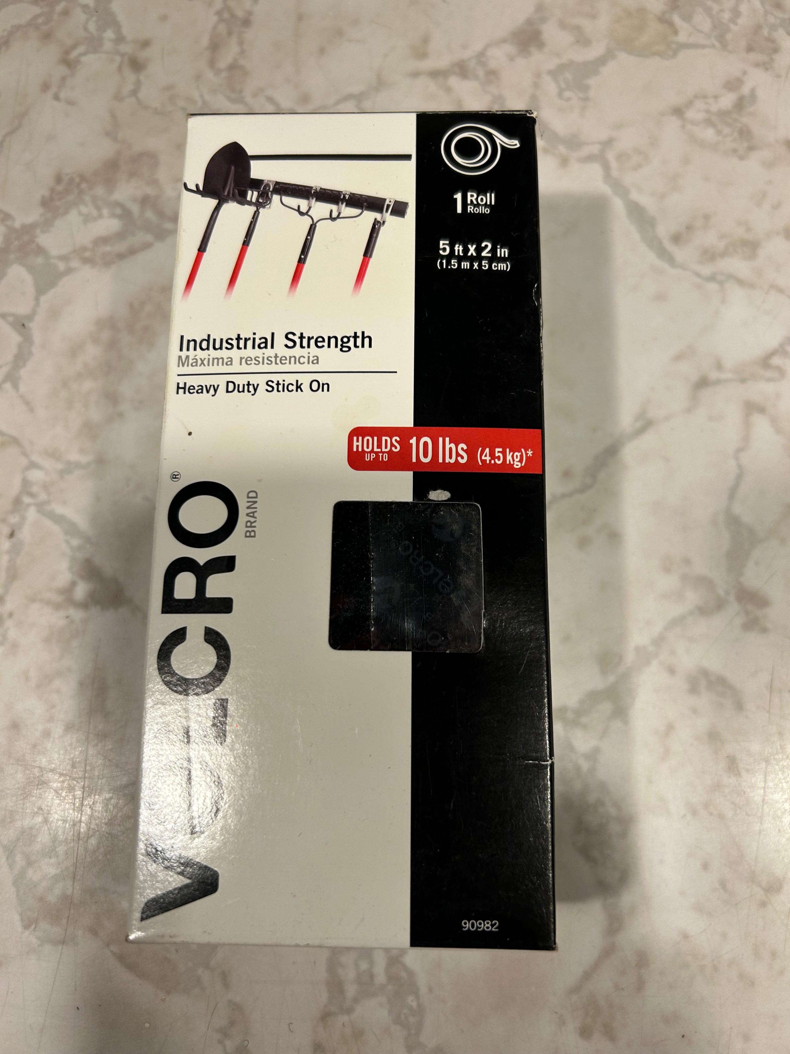 This is a VELCRO Brand Industrial Strength Heavy Duty Tape roll, designed for indoor or outdoor use.The tape is black, measures 2 inches by 5 feet (1.5 m x 5 cm), and comes as a single roll.