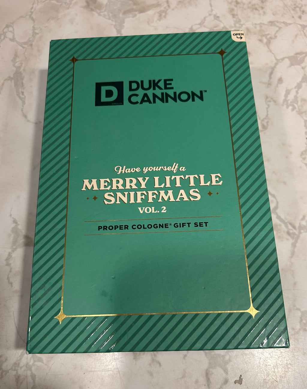 This is a Duke Cannon Supply Co. "Merry Little Sniffmas" proper cologne travel spray gift set.