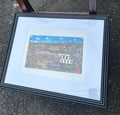 Original signed 15 of 25 “Home is Where The Heart Is" by artist Richard Haskins, featuring a whimsical New England town scene with colorful autumn foliage. “Downtown North Adams