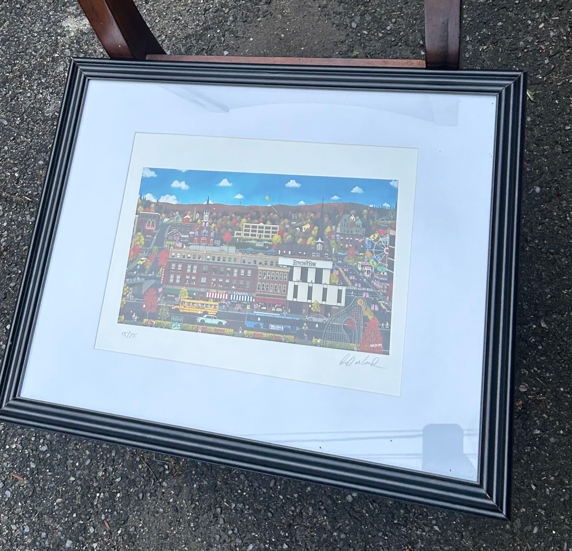 Original signed 15 of 25 “Home is Where The Heart Is" by artist Richard Haskins, featuring a whimsical New England town scene with colorful autumn foliage. “Downtown North Adams