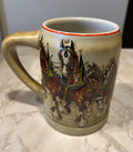This is a 1980 Budweiser Champion Clydesdales Holiday ceramic mug produced by Ceramarte of Brazil.