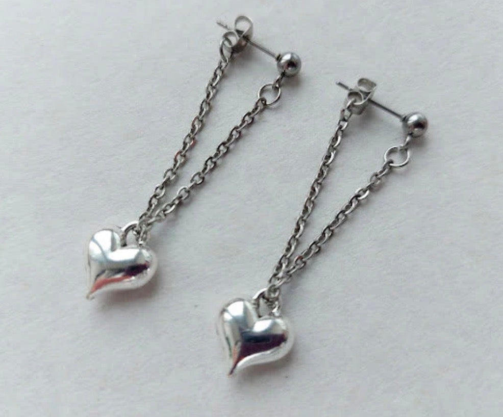 These are stainless steel puffy heart dangle chain earrings.