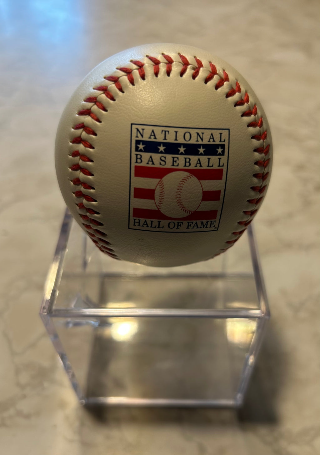 This item is a Rawlings National Baseball Hall of Fame souvenir baseball, often sold in clear plastic display cases.