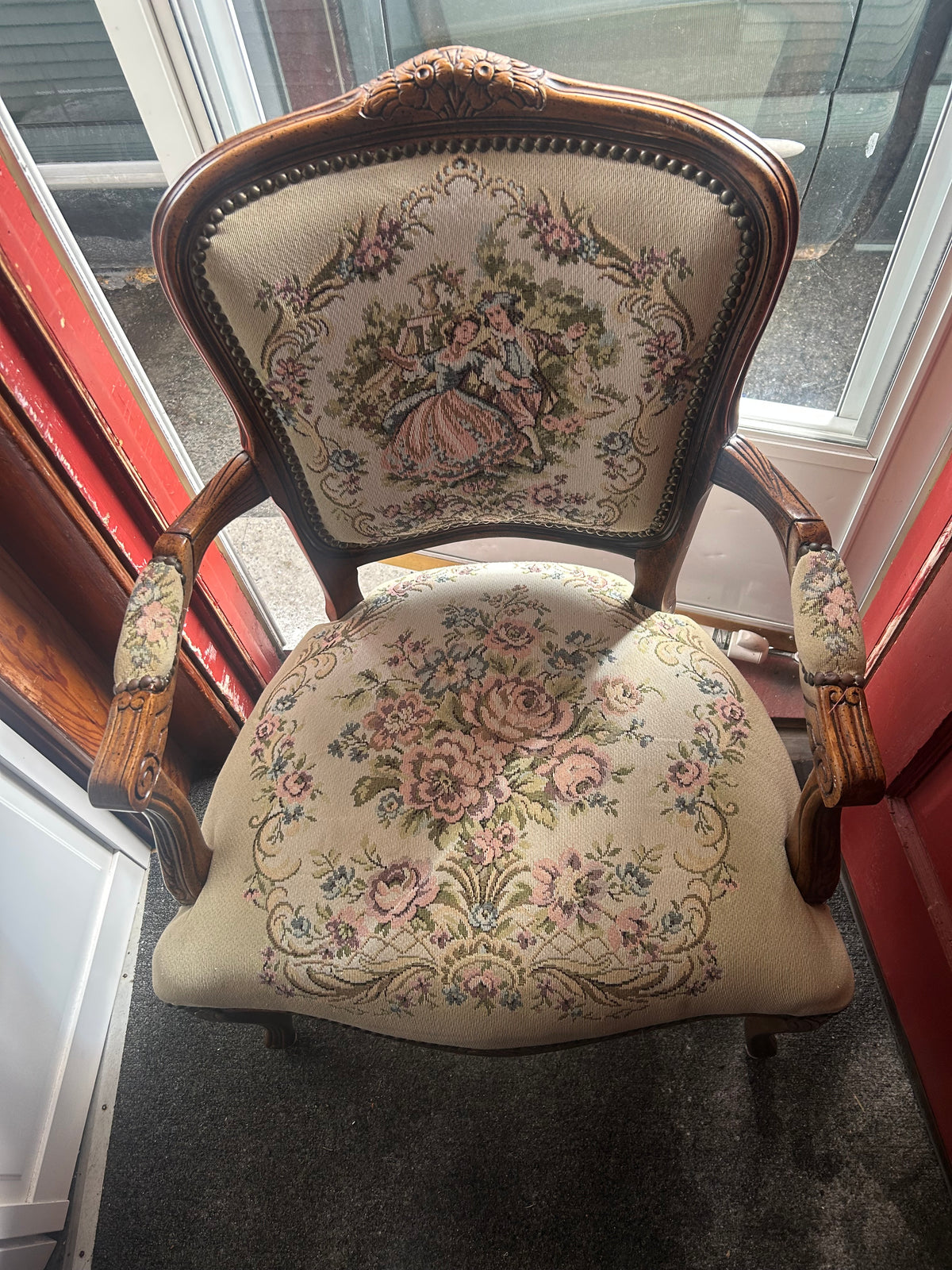 This vintage French Louis XV style (Rococo) tapestry armchair typically holds a market value of $150 to $600, depending on where it is sold and its current condition.