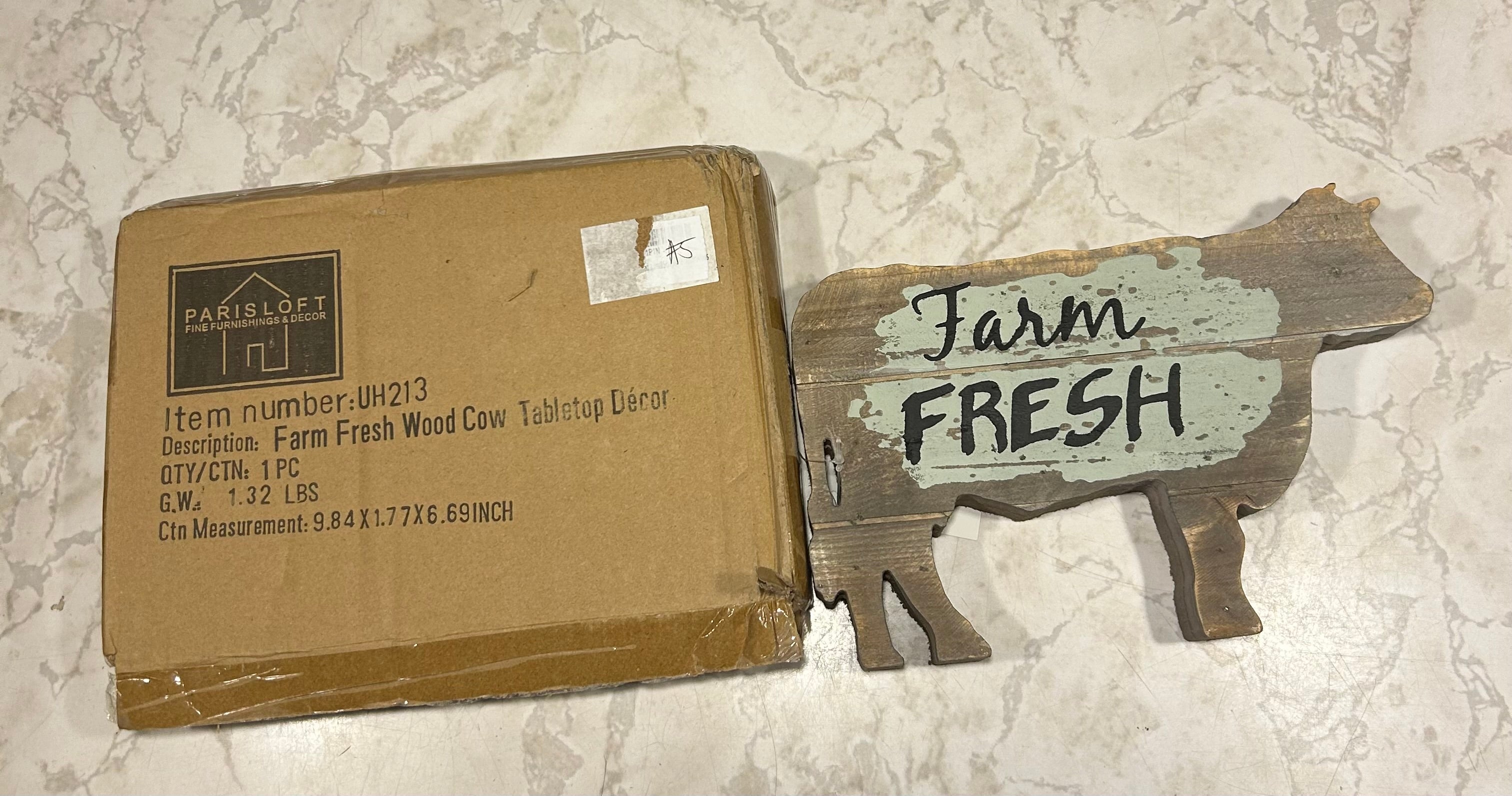 This is a PARISLOFT Farm Fresh Wood Cow Shaped Sign that adds rustic charm to a space.