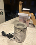 This is a Sonoma Goods For Life medallion electric wax melt warmer.