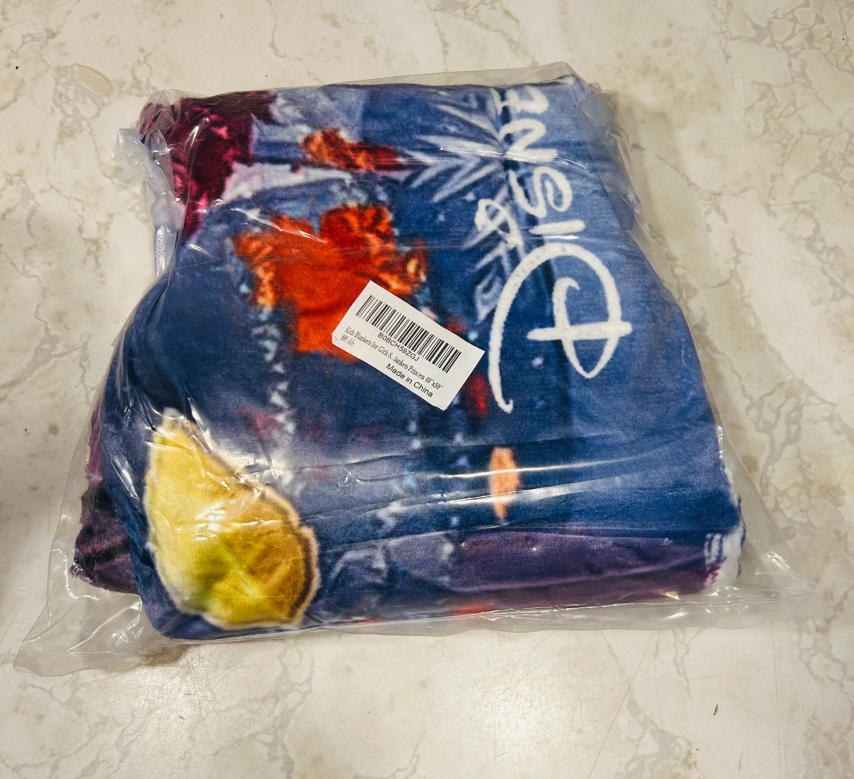 This is a Disney themed microfiber throw blanket, likely featuring characters such as those from Frozen or Wish based on the vibrant blue and purple color scheme