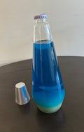 lava lamp replacement bottle, contains blue liquid. H2103