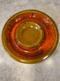This is a vintage Marcia of California ceramic pottery platter featuring a harvest gold and orange drip glaze.