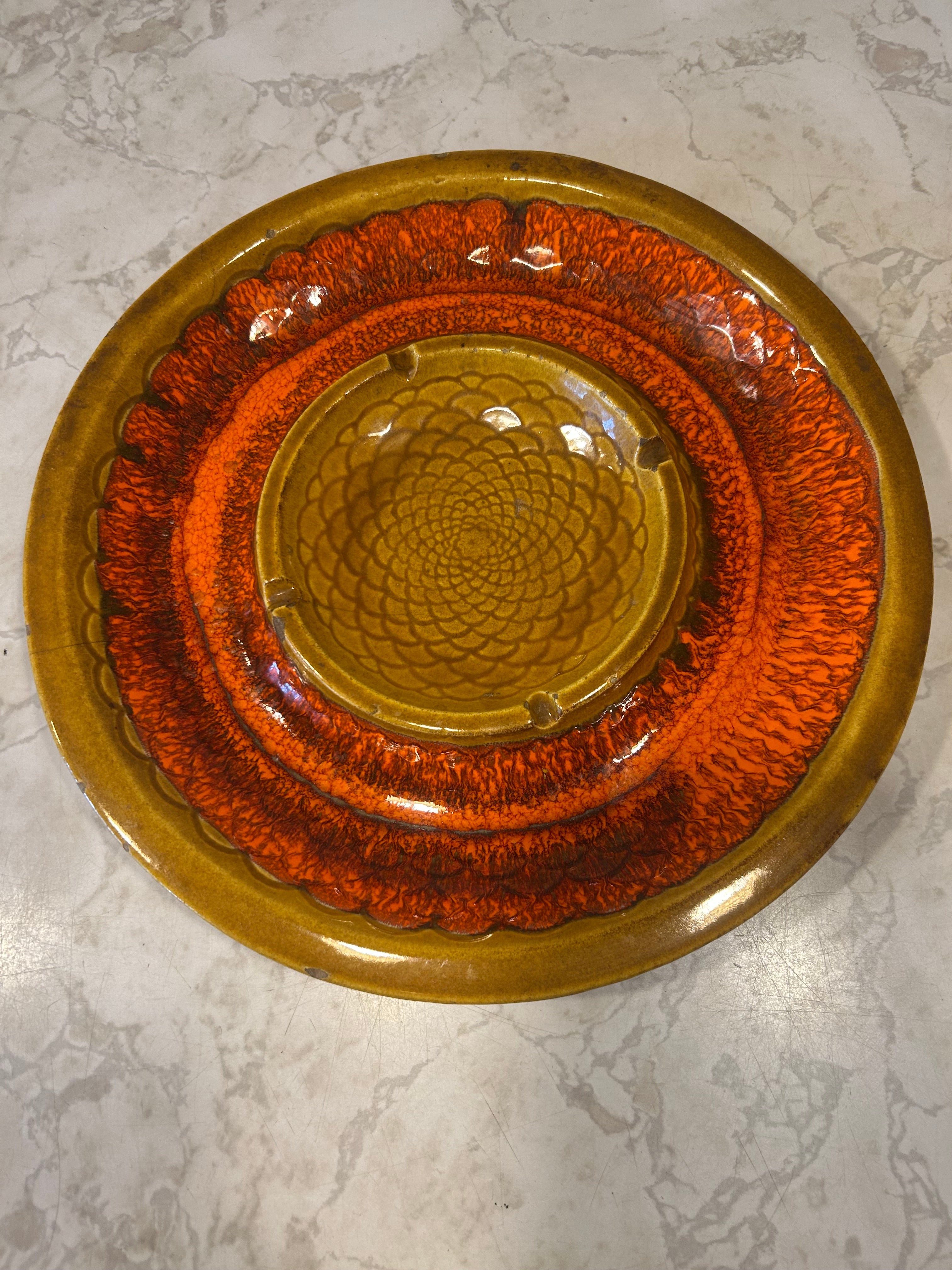 This is a vintage Marcia of California ceramic pottery platter featuring a harvest gold and orange drip glaze.