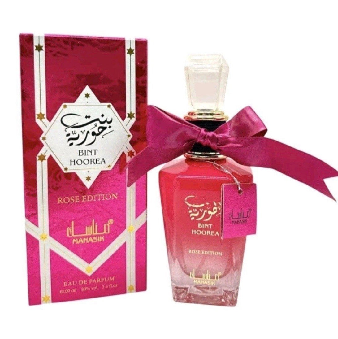This is Bint Hoorea Rose Edition (also referred to as Bint Hooran Rose Passion) by the brand Manasik. Launched in 2024, it is a floral fruity gourmand fragrance designed for women that offers a sweet, playful, and sophisticated aroma.