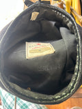 This is a vintage Bancroft Military Caps liner label indicating the item was made in Framingham, Massachusetts.
