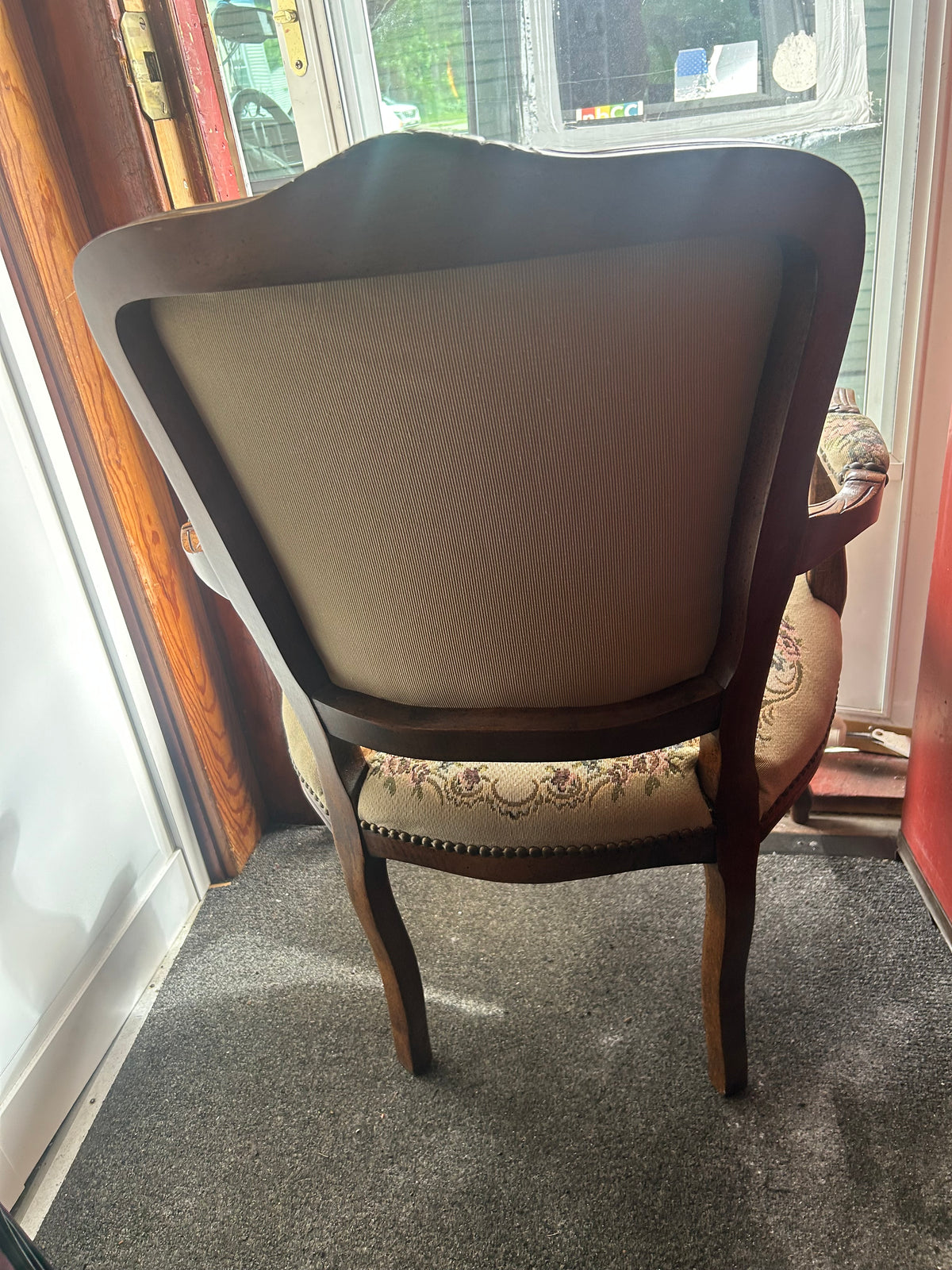 This vintage French Louis XV style (Rococo) tapestry armchair typically holds a market value of $150 to $600, depending on where it is sold and its current condition.