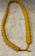 This is a gold nylon cobra knot aiguillette military parade shoulder cord.