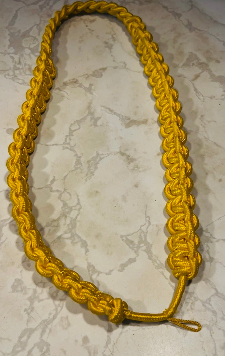 This is a gold nylon cobra knot aiguillette military parade shoulder cord.