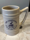 This is a white ceramic beer mug commemorating the 75th Anniversary of an Elk Lodge Veterans Memorial in 1998.