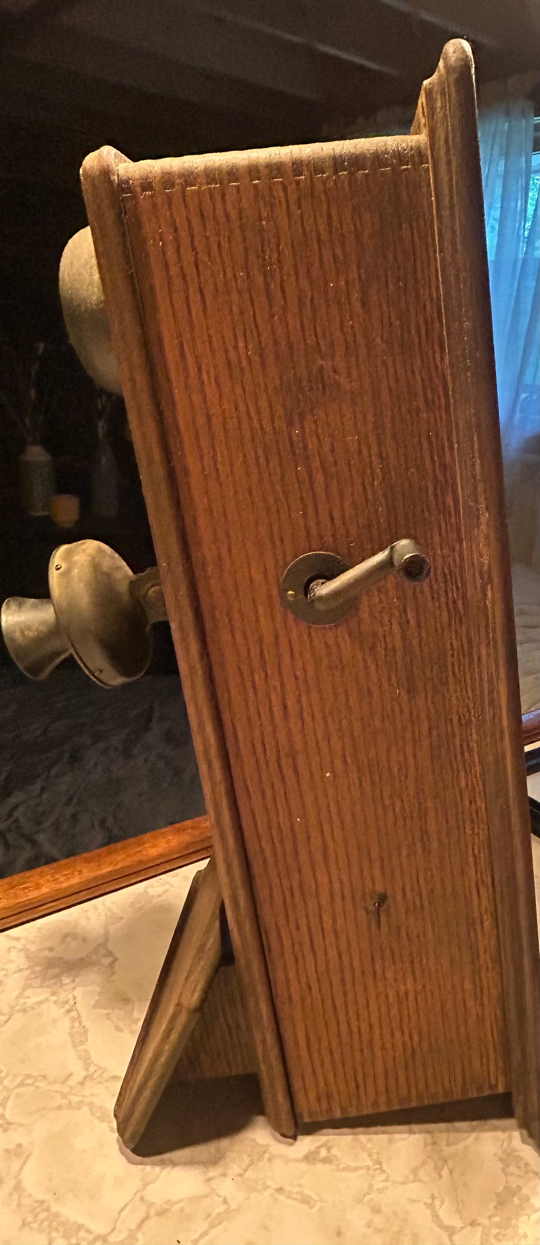 This is an antique wooden wall-mounted crank telephone, likely manufactured by companies such as Kellogg or Western Electric in the early 1900s.