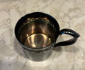 This is a vintage Reed & Barton silver-plated child's cup, model 767.