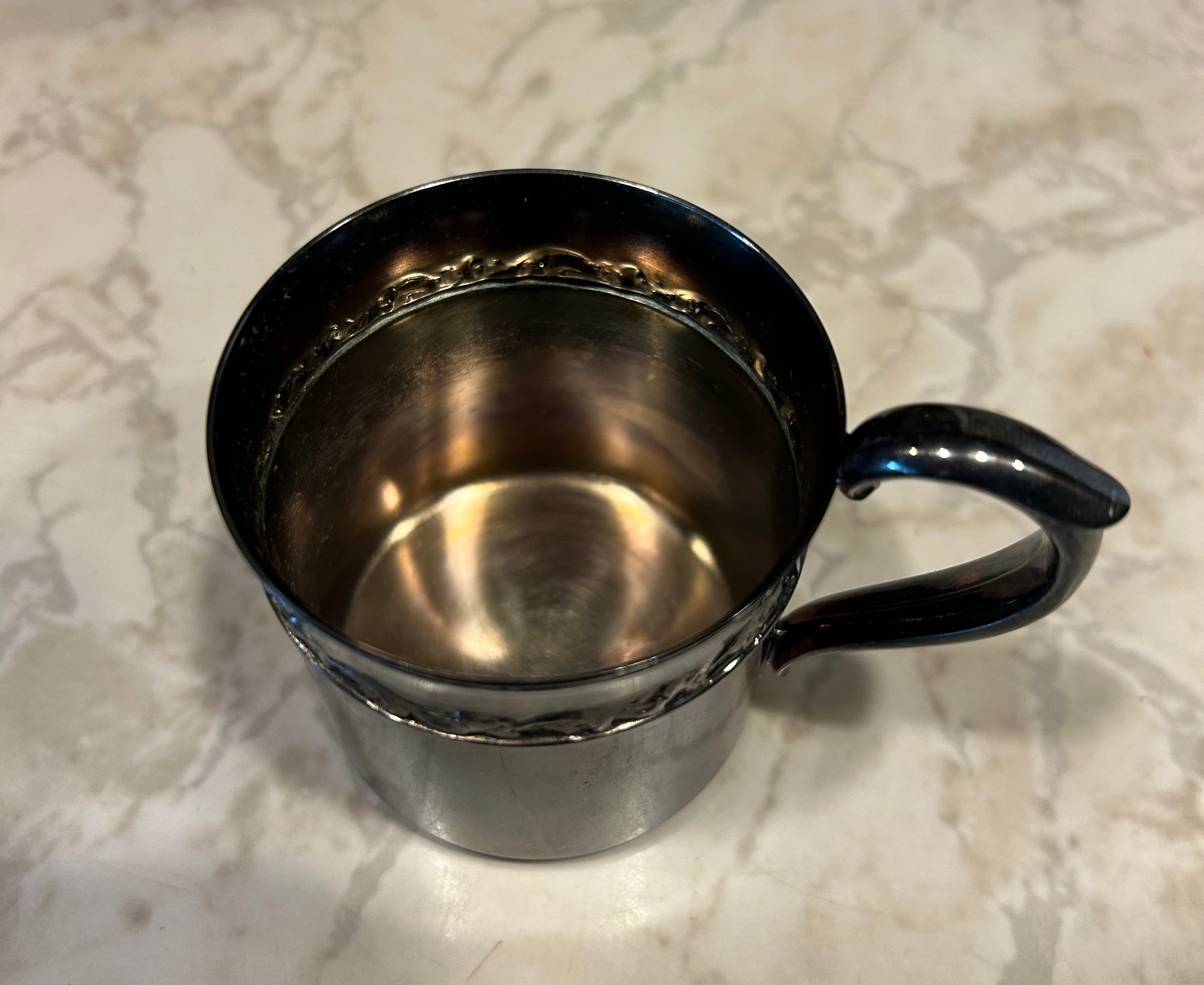 This is a vintage Reed & Barton silver-plated child's cup, model 767.