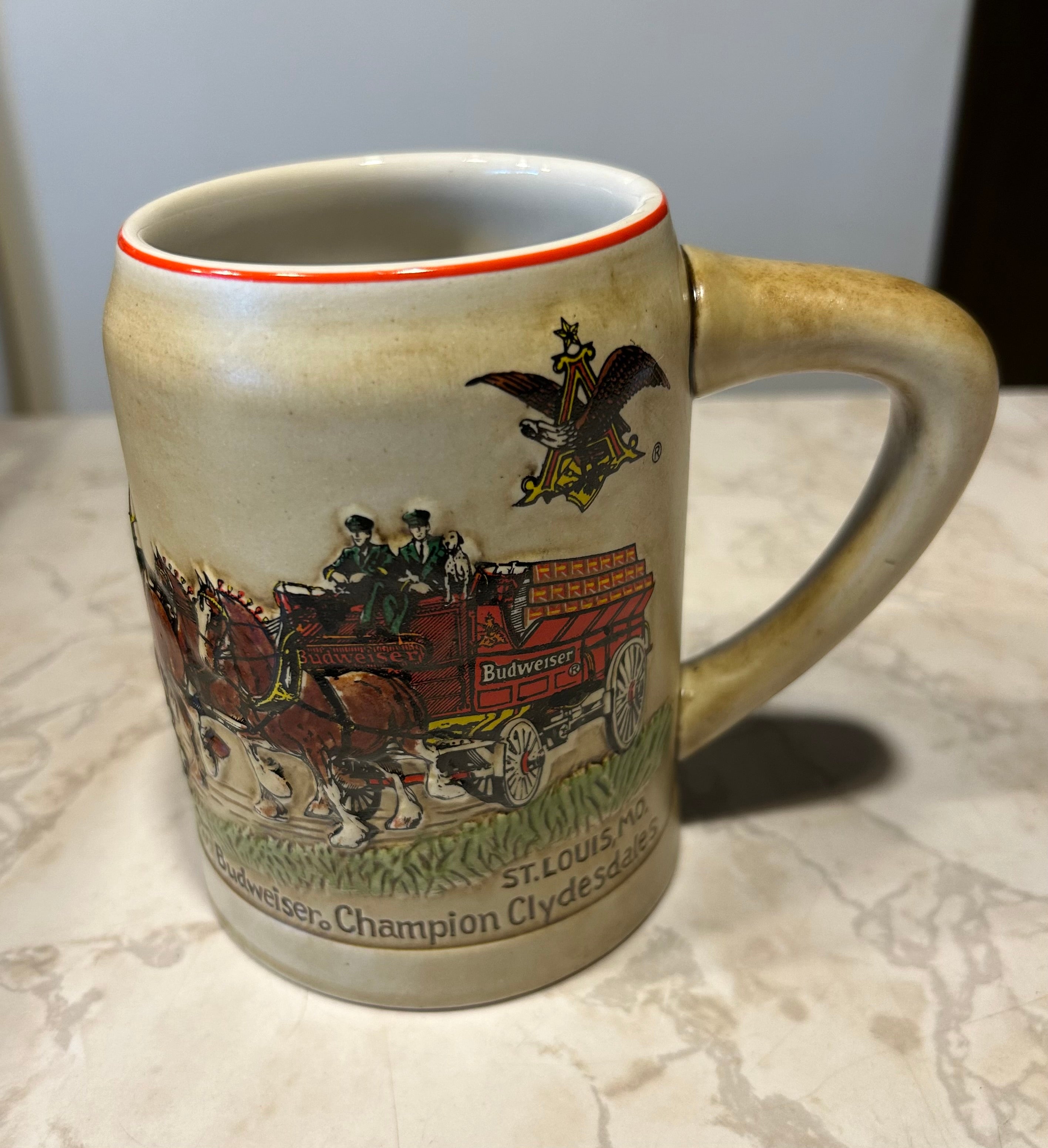 This is a 1980 Budweiser Champion Clydesdales Holiday ceramic mug produced by Ceramarte of Brazil.