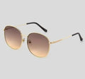 These are Universal Thread gold metal round sunglasses with brown gradient lenses.