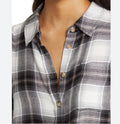 This is a Wild Fable Women's Oversized Long Sleeve Collared Flannel Shirts in Black Plaid.