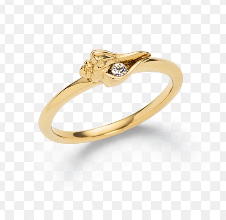 This is a delicate yellow gold ring featuring a small, stylized seashell-shaped design with a tiny accent stone.