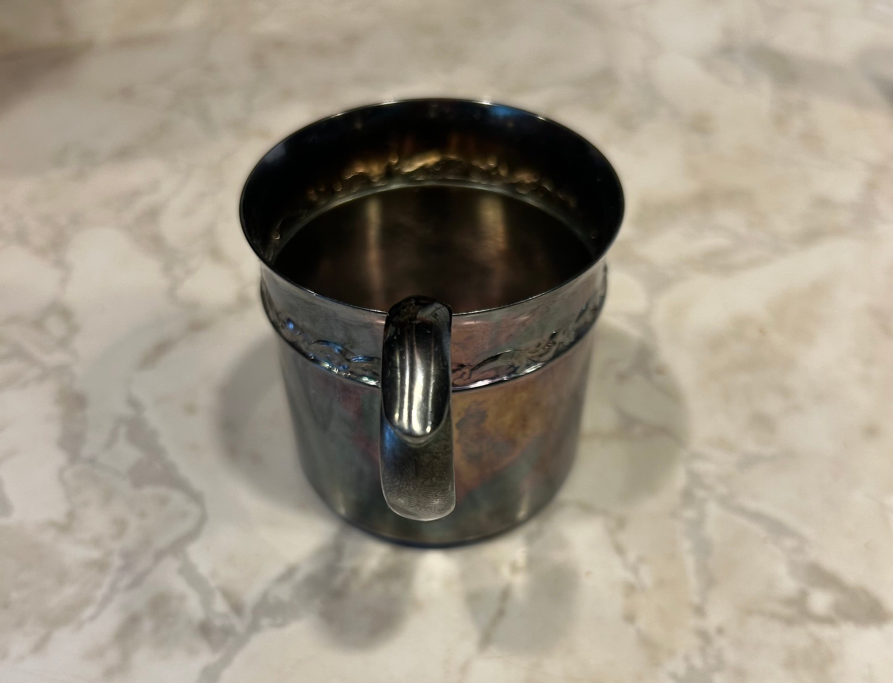 This is a vintage Reed & Barton silver-plated child's cup, model 767.